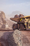 Loading of copper ore on very big dump-body truck